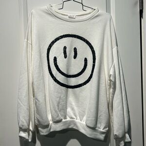 Le Lis smiley face sweater. Size small. NWOT.